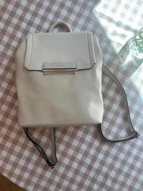 Danielle Nicole Cream Backpack with Gold Bar Accent
